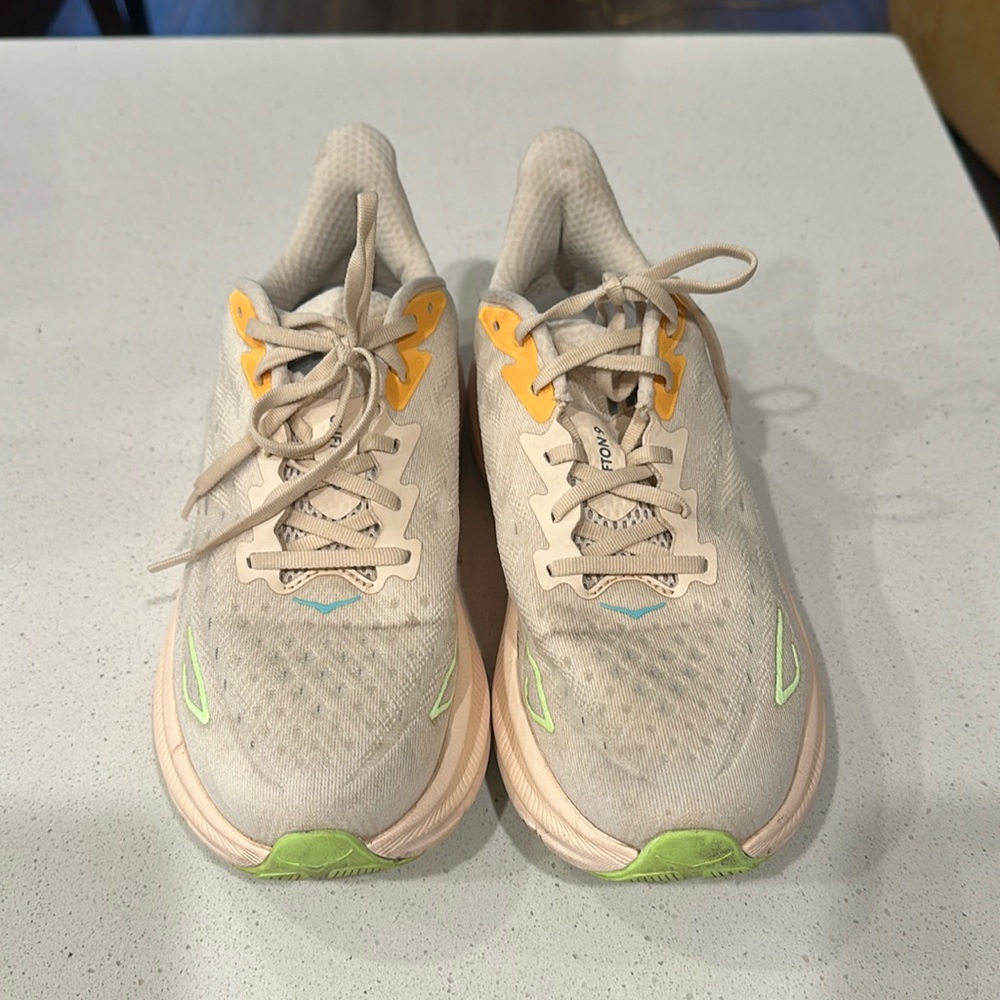 Hoka One One Womens size 10B in cream with coral and green touches.